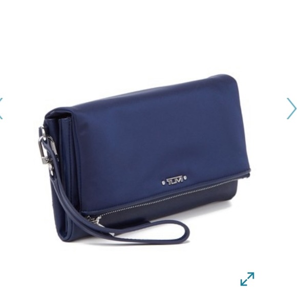 Tumi Handbags - TUMI continental foldover wristlet wallet
